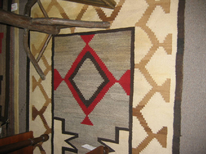 Appraisal: EARLY TH CENTURY NAVAJO RUG The ivory field of stepped