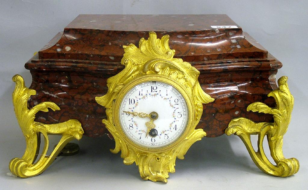 Appraisal: French red marble plateau and ormolu mounted mantel timepiece the