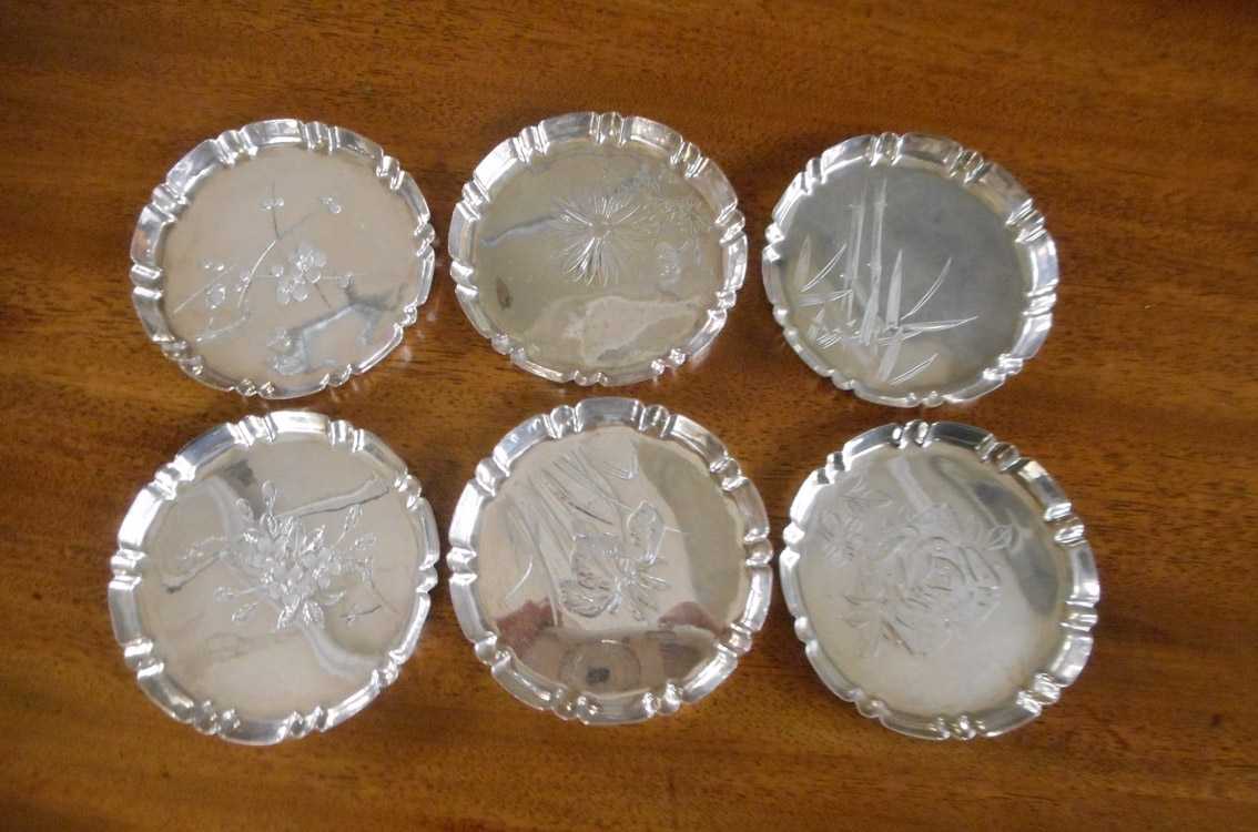 Appraisal: SET OF SIX JAPANESE STERLING SILVER COASTERS engraved with various