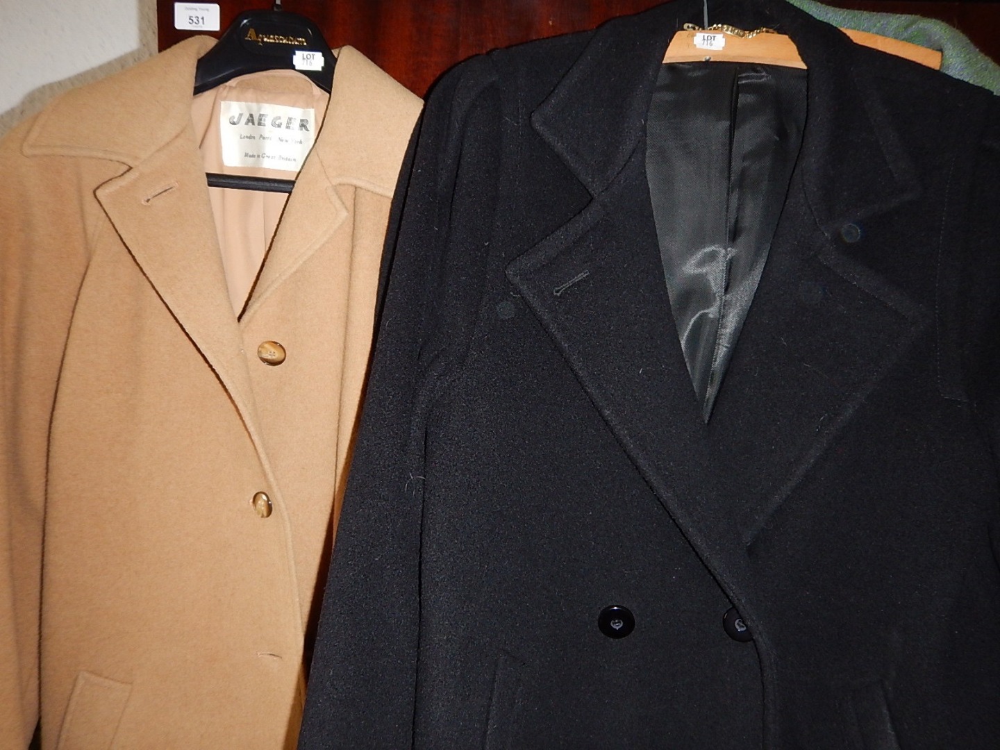 Appraisal: A Jaeger ladies length camel overcoat and a ladies black