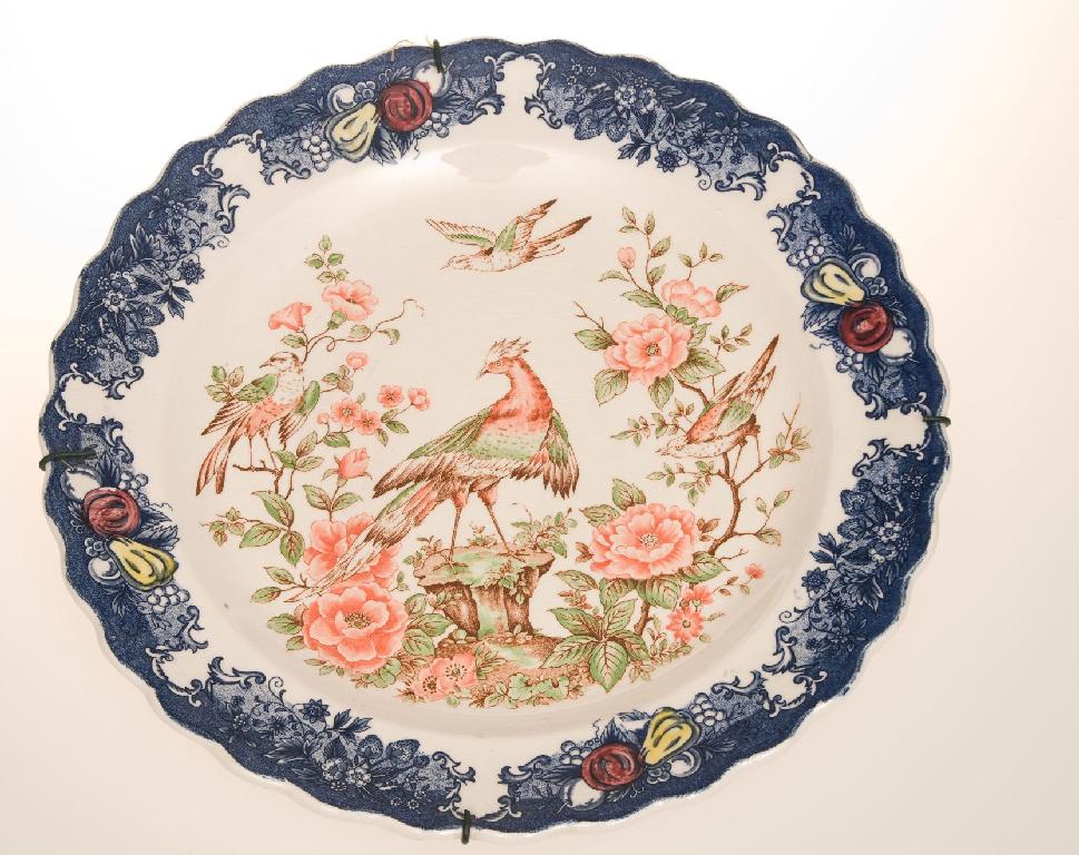 Appraisal: IRONSTONE CHARGER LATE th CENTURY printed with exotic birds within