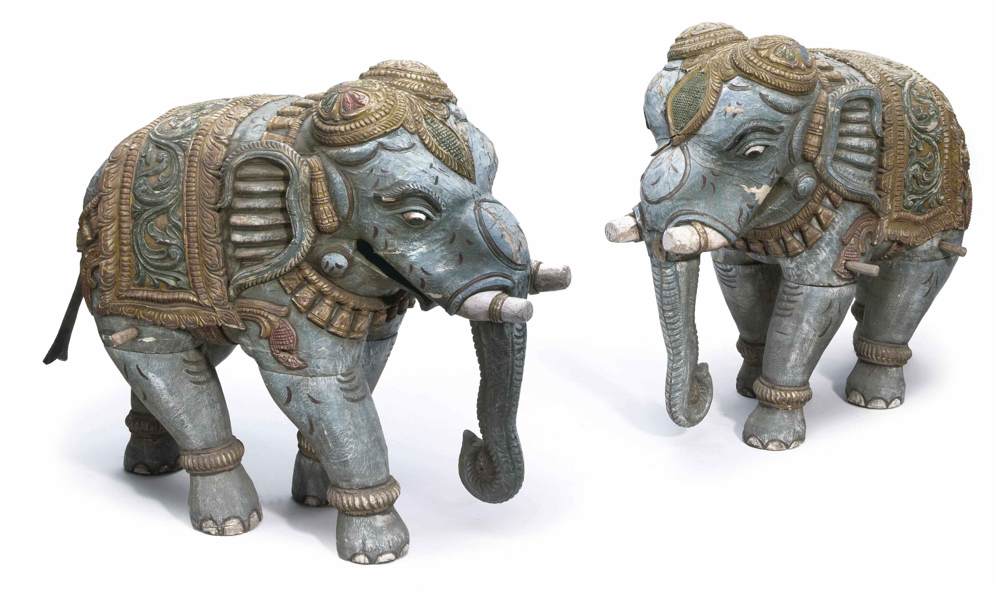 Appraisal: A pair of Indian polychromed carved wood elephant figures height