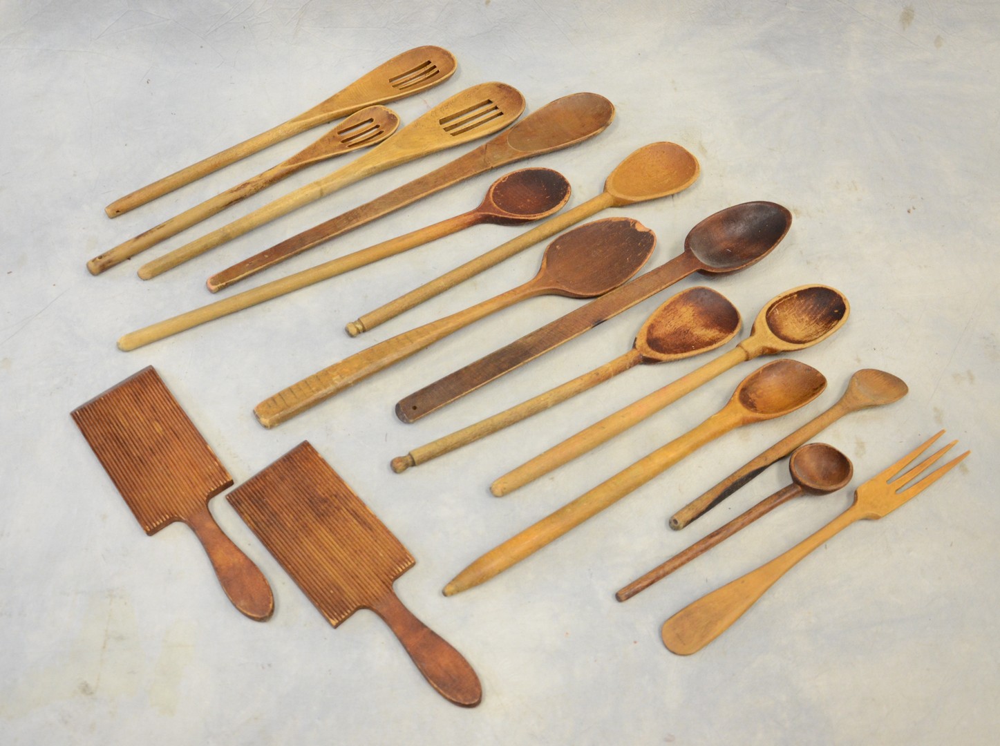 Appraisal: Wooden cooking utensils including slotted spoons butter paddles th C