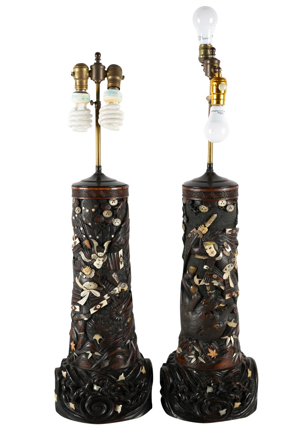 Appraisal: PAIR OF JAPANESE CARVED WOOD INLAID TABLE LAMPSdepicting the samurai