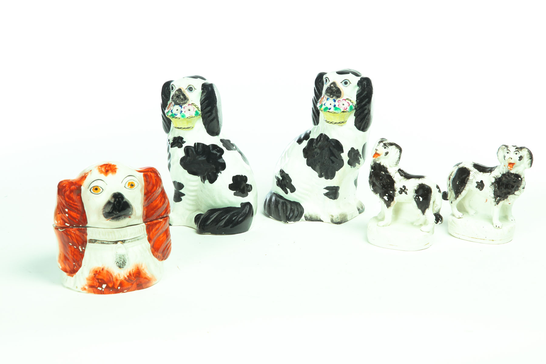 Appraisal: FIVE STAFFORDSHIRE DOGS England nd half- th century Pair of