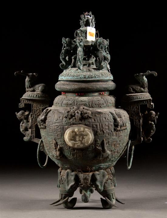 Appraisal: Chinese weathered copper censor with inset jade medallion elaborate relief