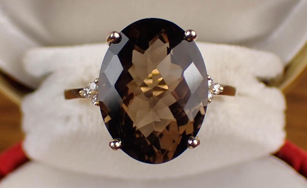 Appraisal: SMOKY QUARTZ DIAMOND AND FOURTEEN KARAT GOLD RING The yellow