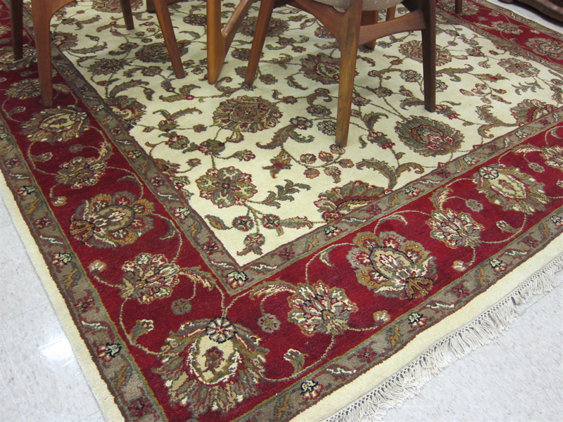 Appraisal: HAND KNOTTED ORIENTAL CARPET Indo-Persian Isfahan floral design on cream