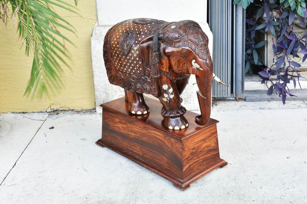 Appraisal: IMPRESSIVE MONUMENTAL INDIAN ROSEWOOD ELEPHANTCirca The massive beast carved from