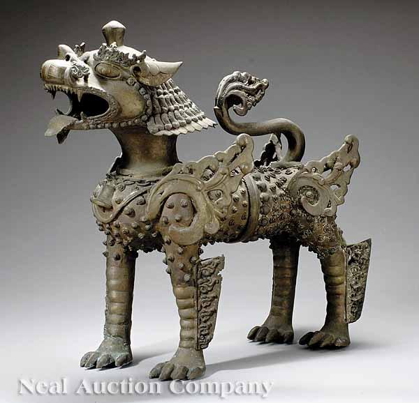 Appraisal: A Southeast Asian Bronze Figure of a Guardian Lion modeled