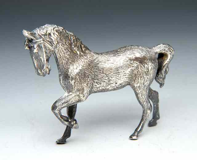 Appraisal: A SMALL SOLID SILVER MODEL OF A HORSE marks for