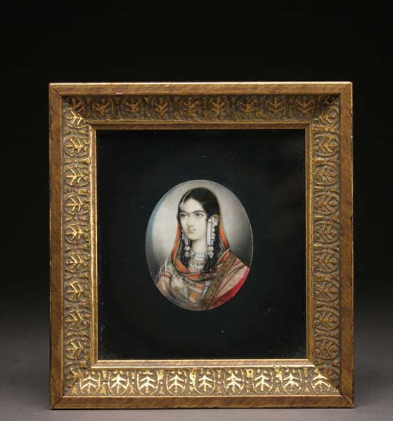 Appraisal: INDIAN IVORY PORTRAIT MINIATURE Moghul-style Indian painted oval ivory portrait