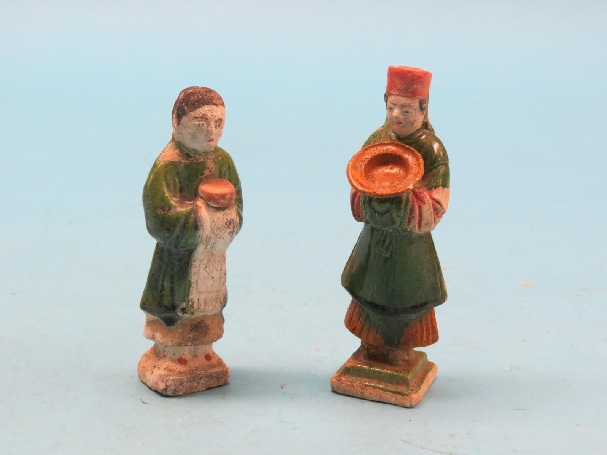 Appraisal: A pair of Ming-style ceramic figures partly glazed each male