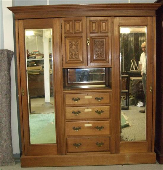 Appraisal: Early th Century walnut Maple style compactum the centre section