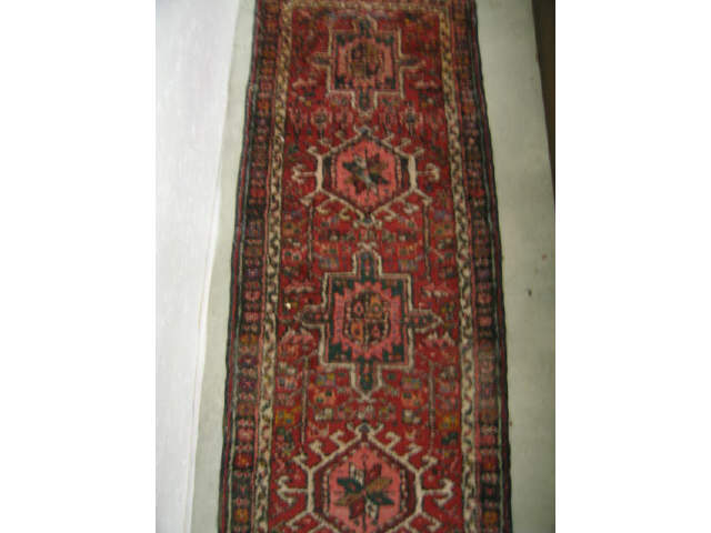 Appraisal: Heriz Persian Handmade Runner geometric medallions on red field '