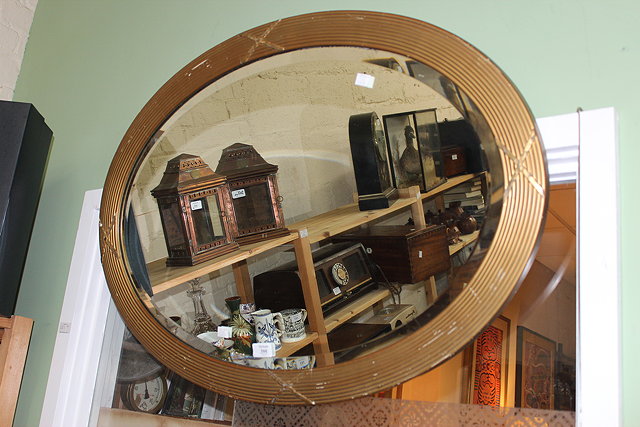 Appraisal: AN EARLY TH CENTURY OVAL GILT FRAMED WALL MIRROR with