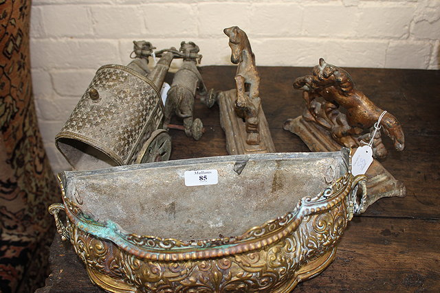 Appraisal: A PRESSED BRASS SERPENTINE FRONTED PLANTER with loop handles and