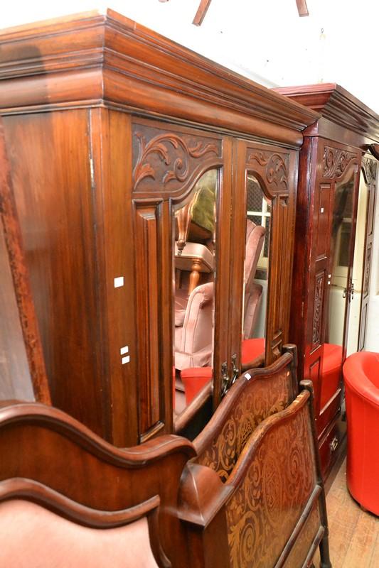 Appraisal: A MAHOGANY WARDROBE WITH TWO MIRRORED DOORS A MAHOGANY WARDROBE