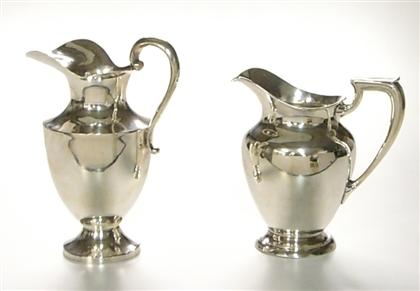 Appraisal: Two American sterling silver pitchers mid- th century The first