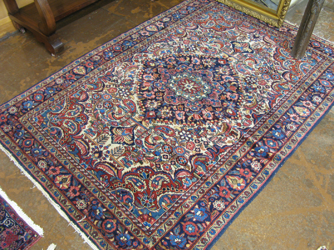 Appraisal: SEMI-ANTIQUE PERSIAN AREA RUG floral and central floral medallion design