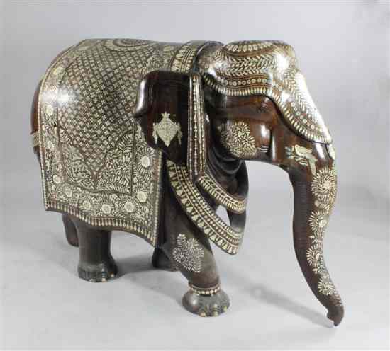 Appraisal: An Indian ivory and bone inlaid hardwood elephant decorated with