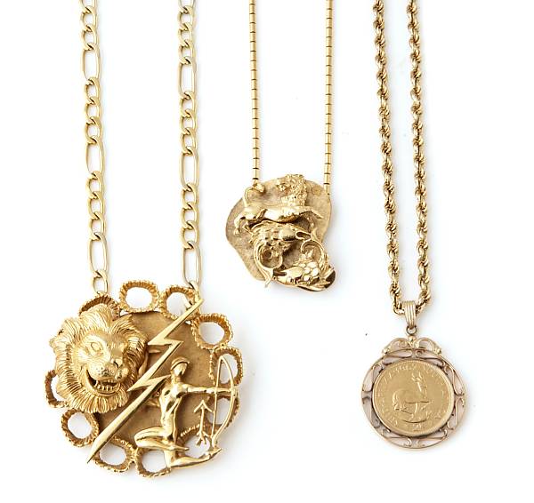 Appraisal: A gold coin necklace and two pendant necklaces gross weight