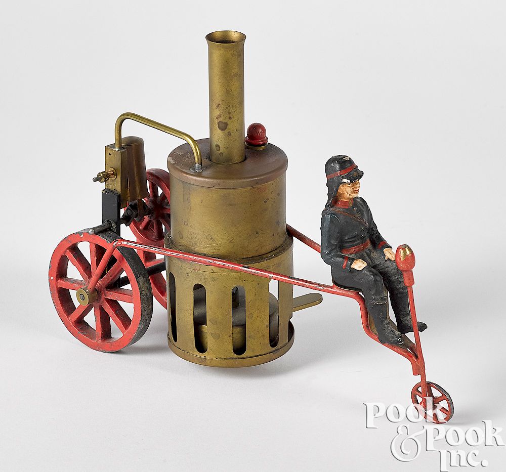 Appraisal: Schoenner brass live steam fire pumper tricycle Schoenner brass live