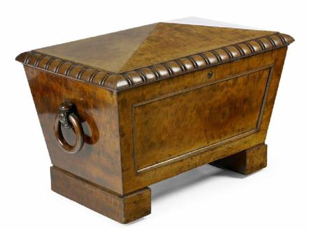 Appraisal: A Regency 'plum pudding' mahogany cellarette of sarcophagus form the