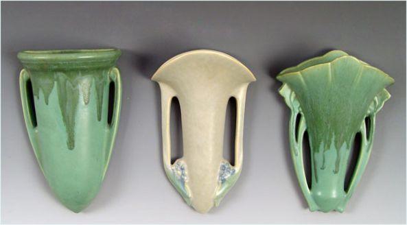 Appraisal: THREE ROSEVILLE POTTERY WALL POCKETS Tuscany and green Carnelian each