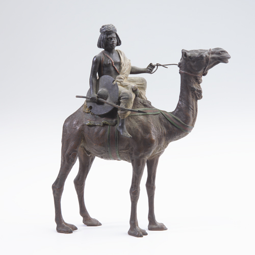 Appraisal: Cold-painted Vienna bronze of a nomad riding a camel early