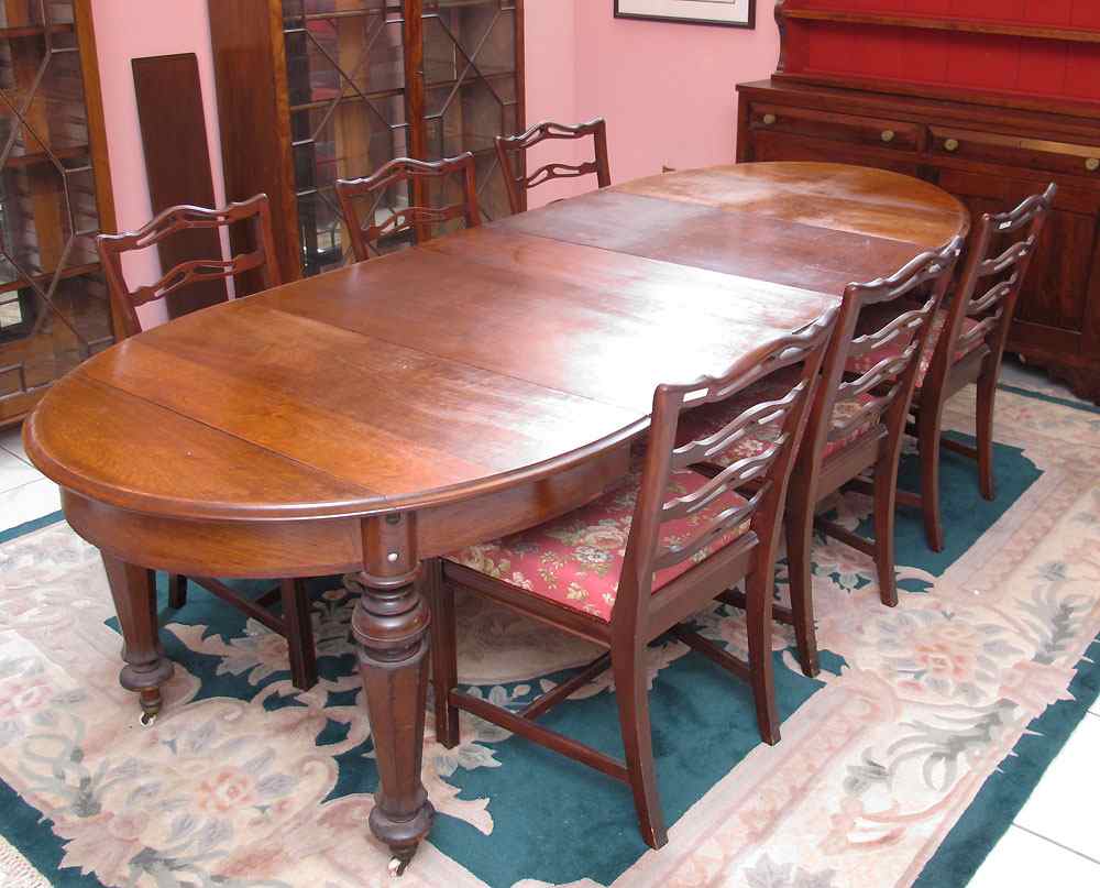 Appraisal: LATE TH CENTURY WALNUT DINING TABLE WITH LEAVES On carved