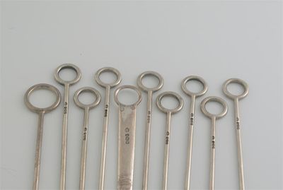 Appraisal: Skewers a set of eight modern poultry skewers with ring