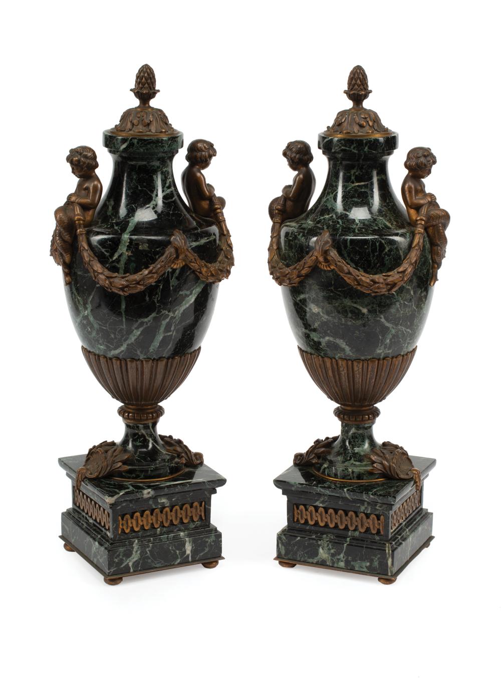 Appraisal: Pair of French Bronze-Mounted Marble Cassolettes cherub handles holding garlands