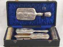 Appraisal: A five piece boxed silver dressing table set comprising two