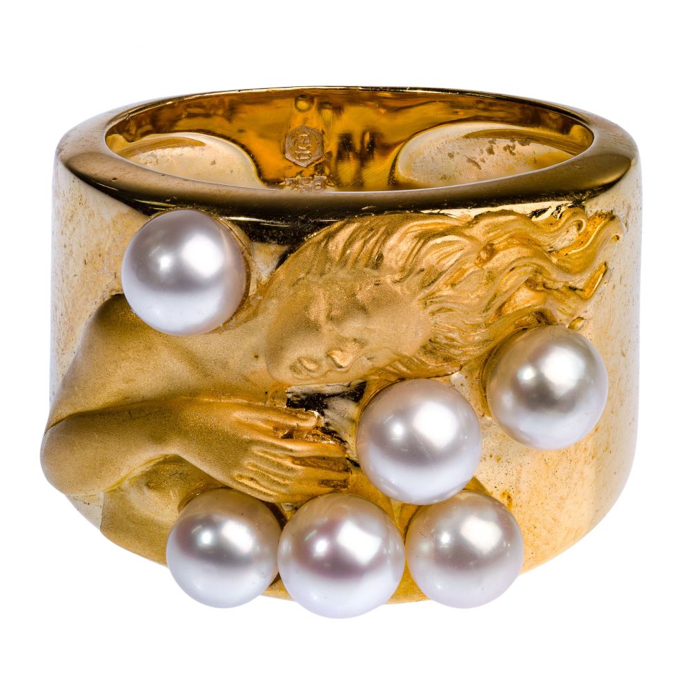 Appraisal: K YELLOW GOLD AND PEARL RINGSatin figure on top of