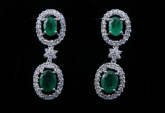 Appraisal: PAIR K WHITE GOLD DIAMOND AND EMERALD DANGLE EARRINGS Each