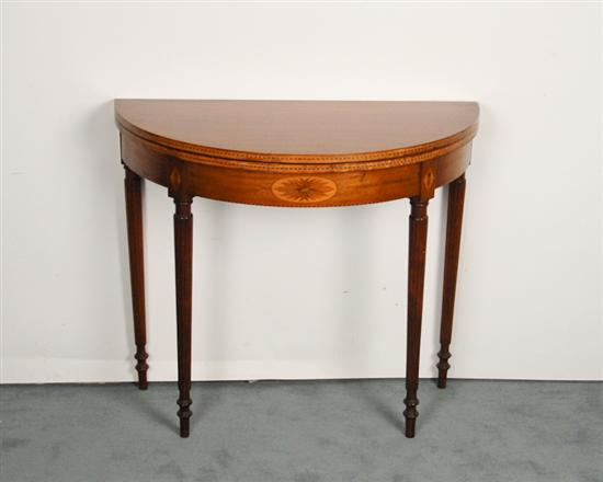 Appraisal: A Federal-style Mahogany Folding Top Card Table demilune with herringbone