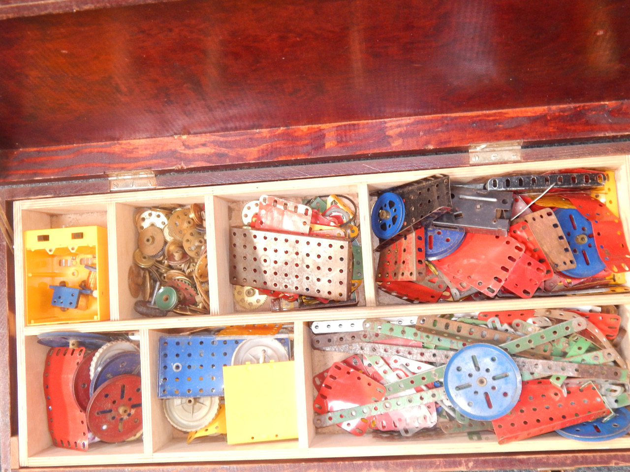 Appraisal: A Meccano selection within wooden trunk comprising mechanical items plates