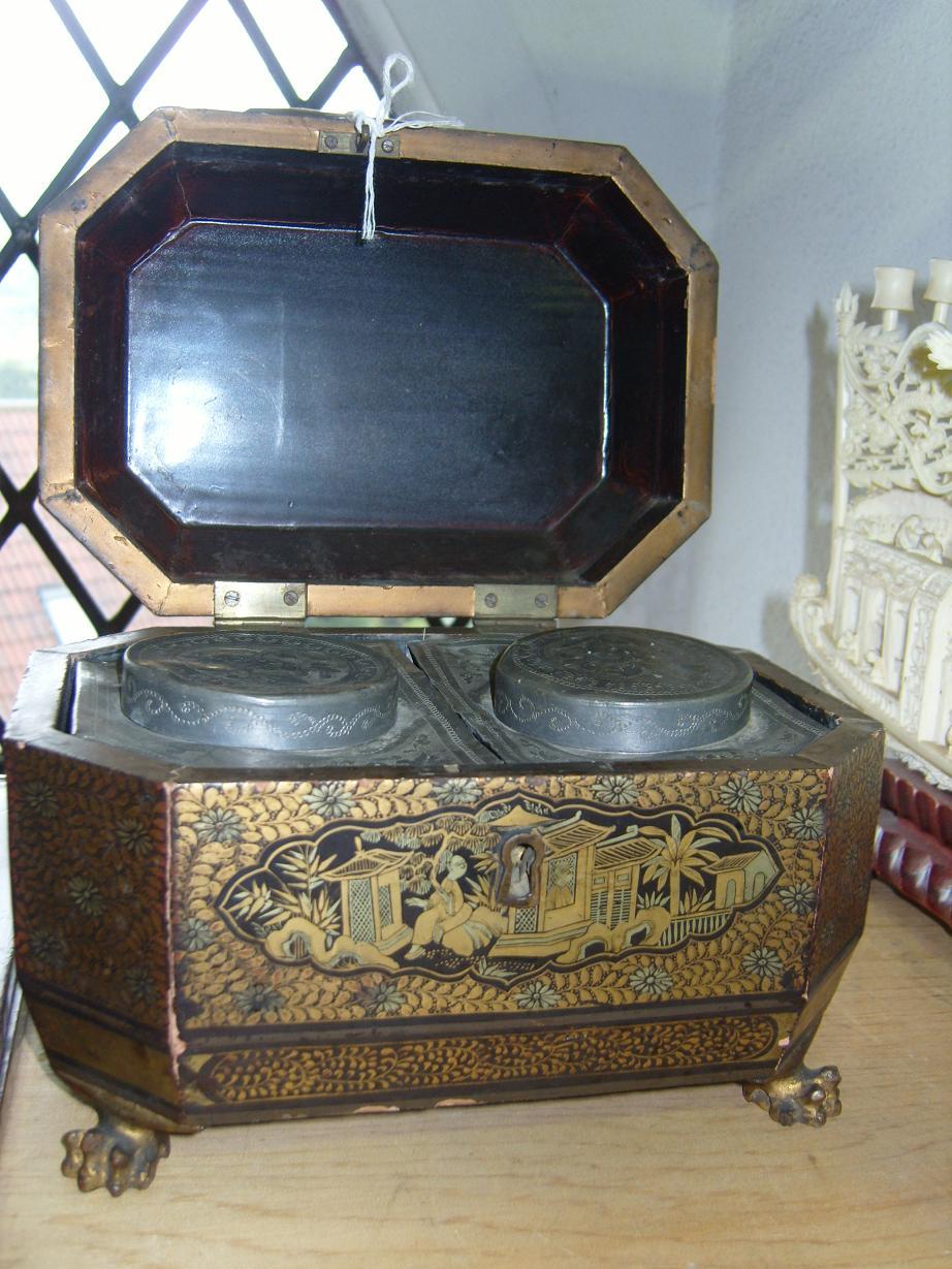 Appraisal: A th century black lacquered tea caddy with gilded and