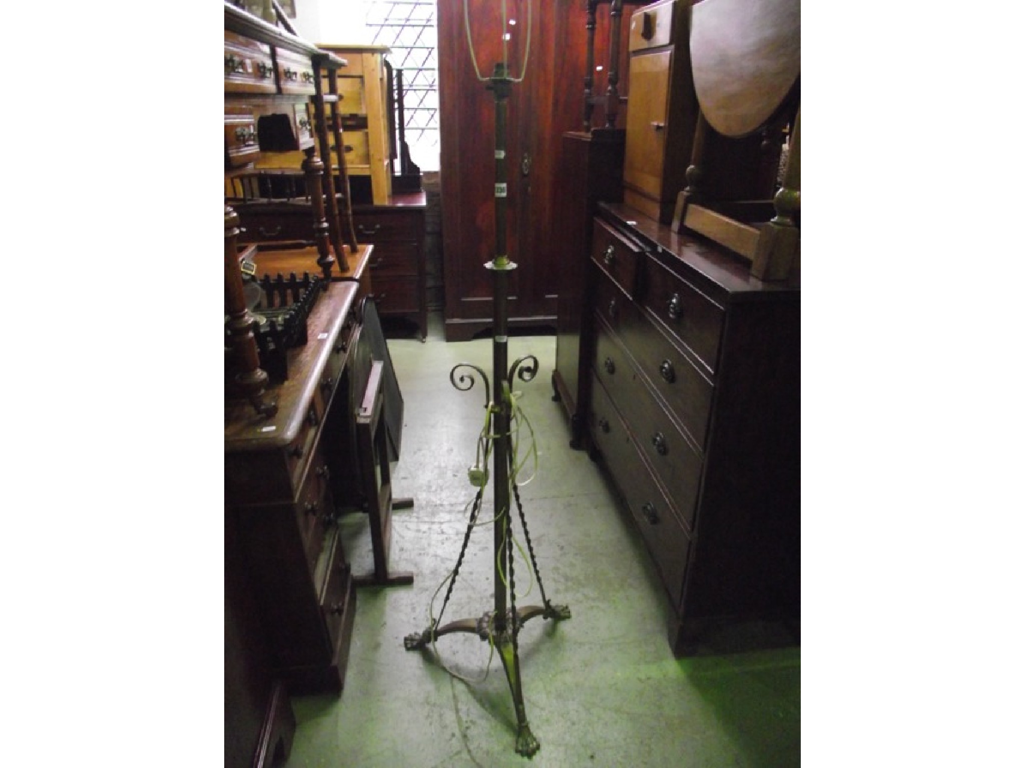 Appraisal: A Victorian brass telescopic oil lamp standard the tripod supports