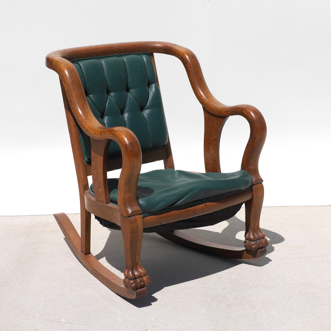 Appraisal: OAK ROCKER FROM WORLD'S FAIR Shaped golden oak arms and