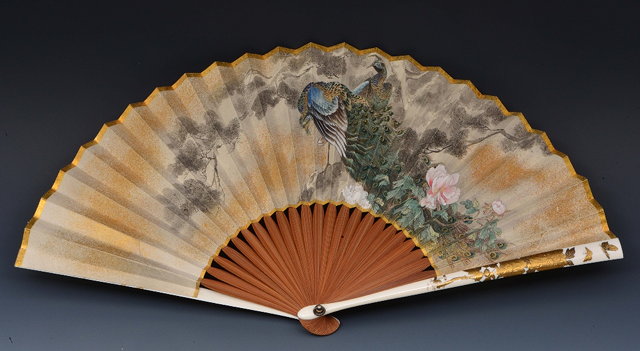 Appraisal: A Japanese paper fan - painted with peacocks and a