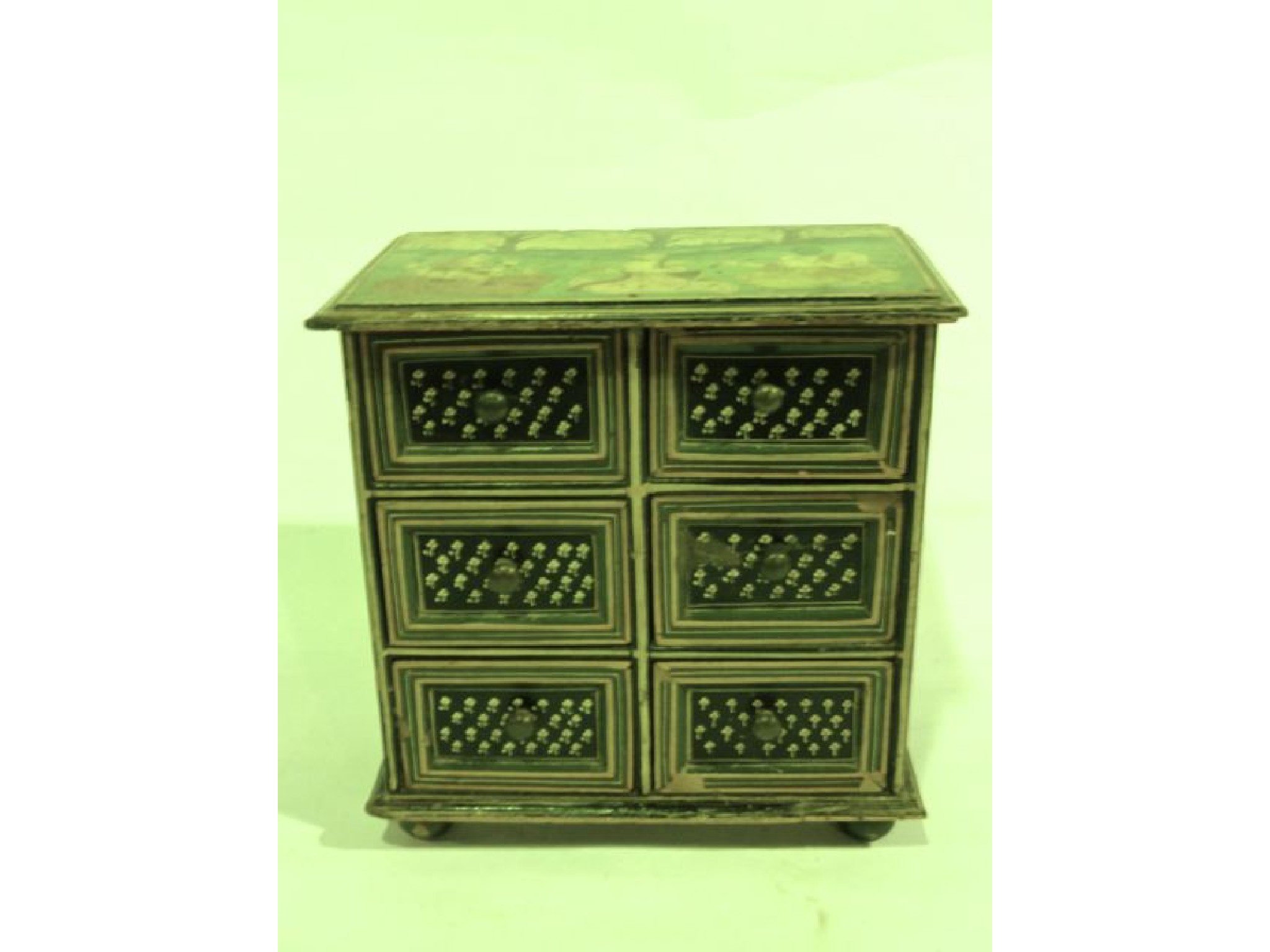 Appraisal: A miniature Indian painted timber cabinet of six matched drawers