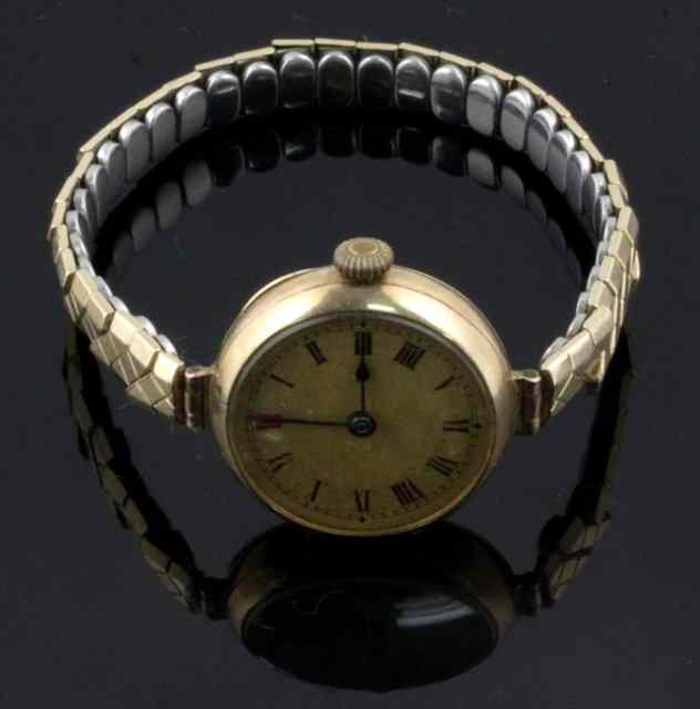 Appraisal: A ct gold cased wristwatch the case numbered the gilt