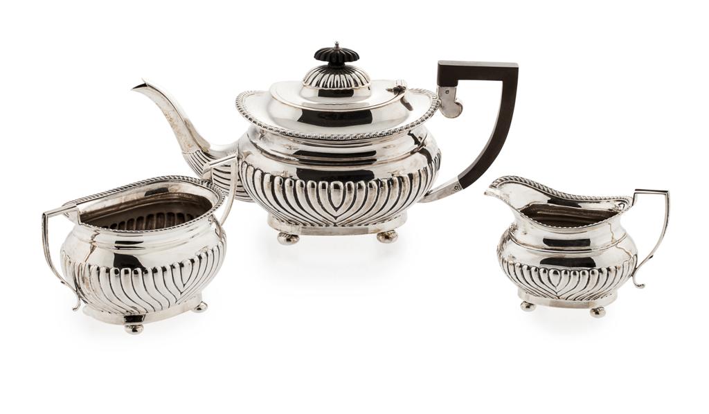 Appraisal: A three piece tea set Birmingham of oval form demi-ribbed