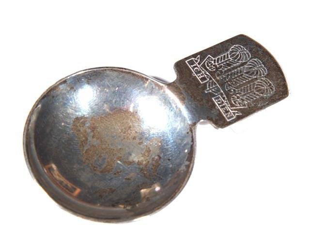 Appraisal: A CONTEMPORARY SILVER CADDY SPOON with circular bowl rectangular handle