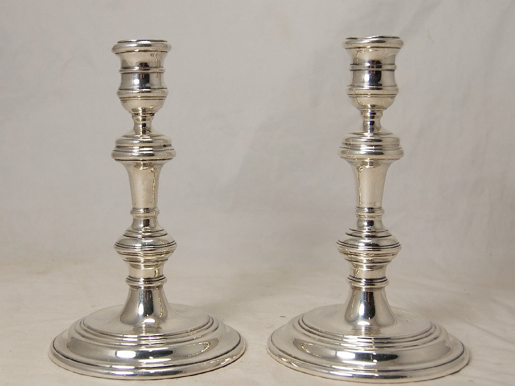 Appraisal: Pair of circular filled candlesticks cm high