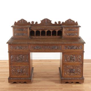 Appraisal: Victorian style carved oak desk Victorian style carved oak desk