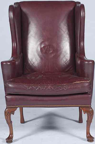 Appraisal: Leather Wing Chair th century a burgundy leather wing chair