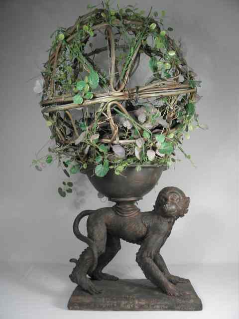 Appraisal: Decorative resin monkey sculpture planter Vine ball above monkey can